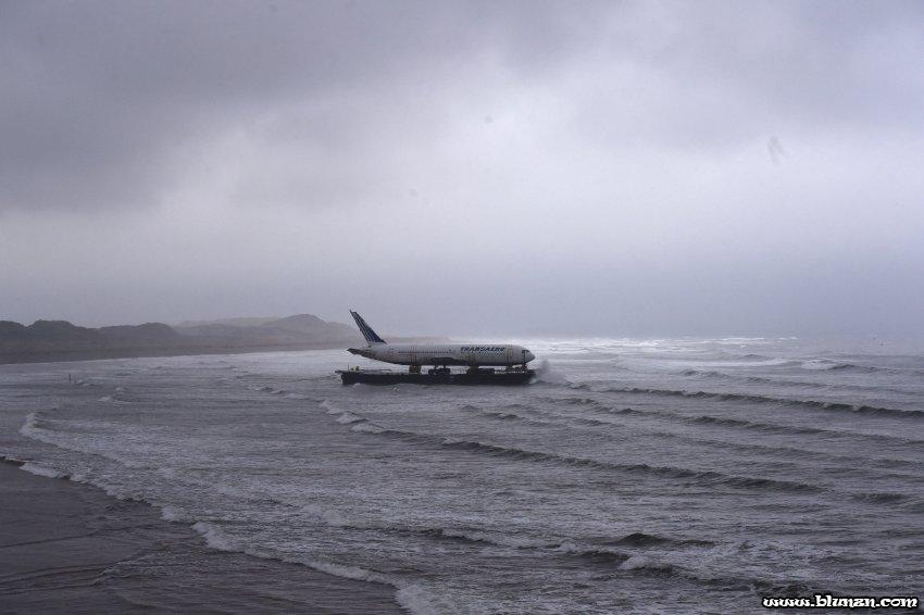 Bad weather surrounds a Boeing 767 airplane as it arrives onto Enniscrone beach after it was tugged from Shannon airport out to sea around the west coast of Ireland, May 7, 2016. It is destined for local funeral director David McGowan's proposed Glamping Village to be used as accommodation in Sligo, Ireland. REUTERS/Clodagh Kilcoyne TPX IMAGES OF THE DAY